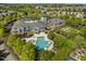 Stunning aerial view of community clubhouse with swimming pool, spa, and well-manicured landscaping at 320 Easton Grey Loop, Cary, NC 27519