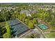Aerial shot of community tennis courts surrounded by lush landscaping, showcasing recreational opportunities at 320 Easton Grey Loop, Cary, NC 27519
