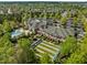 Expansive community center featuring an impressive facade, green spaces, and a meticulously maintained lawn bowling area at 320 Easton Grey Loop, Cary, NC 27519