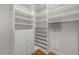 Spacious walk-in closet with custom shelving, drawers, and organized storage solutions at 320 Easton Grey Loop, Cary, NC 27519