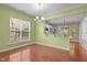 Cozy dining room with hardwood floors and large window overlooking the front yard at 320 Easton Grey Loop, Cary, NC 27519