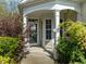 Inviting front porch with decorative plants, creating a warm and welcoming entrance to the home at 320 Easton Grey Loop, Cary, NC 27519