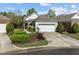 Well-maintained home with an attached garage and beautiful landscaping, offering a welcoming feel at 320 Easton Grey Loop, Cary, NC 27519