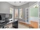 Bright home office featuring hardwood floors, natural light, and wainscotting at 320 Easton Grey Loop, Cary, NC 27519