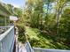 Beautiful backyard with lush lawn, greenery, perfect for recreation, and a nice view from the top of the stairs at 3320 Marblehead Ln, Raleigh, NC 27612