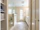 Bathroom featuring a glass-enclosed shower, double vanity, linen closet, and natural light at 3320 Marblehead Ln, Raleigh, NC 27612