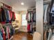 Walk-in closet with custom shelving, ample storage for clothing, and a vanity area at 3320 Marblehead Ln, Raleigh, NC 27612
