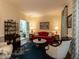 Bright living room featuring elegant furnishings, a marble table, and a view of the dining room at 3320 Marblehead Ln, Raleigh, NC 27612