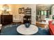 Inviting living room featuring a blue rug, and a view into the adjacent dining area at 3320 Marblehead Ln, Raleigh, NC 27612