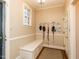 Convenient mudroom with a built-in bench, storage, and a window for natural light at 3320 Marblehead Ln, Raleigh, NC 27612
