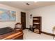 Office space featuring a wooden desk, chair, bookshelf and a map of the world at 3320 Marblehead Ln, Raleigh, NC 27612
