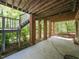 Covered patio area with brick supports and stairs leading up to the back yard at 3320 Marblehead Ln, Raleigh, NC 27612