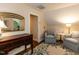 Sitting area with hardwood floors, decorated with an antique mirror and ornate table at 3320 Marblehead Ln, Raleigh, NC 27612