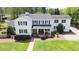 Charming two-story home featuring black shutters, a covered front porch, and a well-manicured lawn at 3609 Hawthorne Rd, Rocky Mount, NC 27804