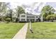 Beautiful two-story home with manicured lawn, brick walkway, black shutters, and mature landscaping at 3609 Hawthorne Rd, Rocky Mount, NC 27804