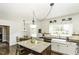 Bright kitchen with stainless steel appliances, granite countertops, and a central island with seating at 3609 Hawthorne Rd, Rocky Mount, NC 27804