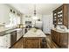 Elegant kitchen featuring stainless steel appliances, an island, granite countertops, and wooden floors at 3609 Hawthorne Rd, Rocky Mount, NC 27804