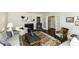 Bright living room with fireplace, french doors, hardwood floors, and elegant furnishings at 3609 Hawthorne Rd, Rocky Mount, NC 27804