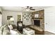 Inviting living room with a brick fireplace, built-in shelving, and comfortable furnishings at 3609 Hawthorne Rd, Rocky Mount, NC 27804