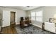 Well-lit home office with hardwood floors, neutral walls, and a large window at 3609 Hawthorne Rd, Rocky Mount, NC 27804