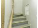 Simple staircase featuring yellow tread markings, and a white banister rail at 3609 Hawthorne Rd, Rocky Mount, NC 27804