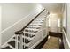 Stairway featuring wood trim and stairs leading to the entrance, showcasing classic home design at 3609 Hawthorne Rd, Rocky Mount, NC 27804