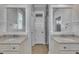 Elegant bathroom with double vanities, granite countertops, and large mirrors at 39 Drayton St, Clayton, NC 27527