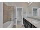 Bright bathroom featuring a bathtub-shower combination and double sink vanity at 39 Drayton St, Clayton, NC 27527