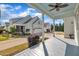 Spacious covered porch featuring a blue ceiling and views of the manicured yard at 39 Drayton St, Clayton, NC 27527