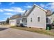 Attractive home featuring a large garage, covered porch, and lush landscaping for curb appeal at 39 Drayton St, Clayton, NC 27527