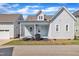 Beautiful home showcasing a spacious porch, manicured landscaping, and a charming entrance at 39 Drayton St, Clayton, NC 27527