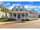 Charming home with a covered front porch and beautifully landscaped yard at 39 Drayton St, Clayton, NC 27527