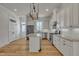 Modern kitchen featuring white cabinets, stainless appliances, and a center island at 39 Drayton St, Clayton, NC 27527