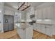 Well-equipped kitchen with white cabinets, granite counters, and stainless steel appliances at 39 Drayton St, Clayton, NC 27527