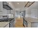 Well-designed kitchen with stainless steel appliances, white cabinets, and granite countertops at 39 Drayton St, Clayton, NC 27527