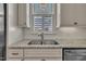 Close-up of kitchen sink with granite counters and white subway tile backsplash at 39 Drayton St, Clayton, NC 27527