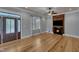 Light-filled living room with hardwood floors, fireplace and double door entrance at 39 Drayton St, Clayton, NC 27527