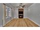 Inviting living room featuring hardwood floors, fireplace and large windows at 39 Drayton St, Clayton, NC 27527