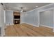 Cozy living room with a fireplace, wooden accent wall and hardwood floors at 39 Drayton St, Clayton, NC 27527