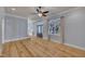 Bright living room featuring hardwood floors, and large windows at 39 Drayton St, Clayton, NC 27527