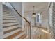 Staircase leading to the second floor with natural lighting and hardwood flooring at 39 Drayton St, Clayton, NC 27527