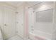 Bright bathroom features a tub with white tile surround and decorative tile inlay at 3928 White Chapel Way, Raleigh, NC 27615