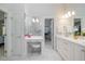 Bathroom with vanity, marble floors, access to shower, closet, and bedroom at 3928 White Chapel Way, Raleigh, NC 27615