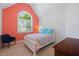 Inviting bedroom with a vaulted ceiling, colorful accents, large windows, and comfortable furnishings at 3928 White Chapel Way, Raleigh, NC 27615