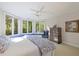 This spacious bedroom features large bay windows offering a view of the wooded backyard at 3928 White Chapel Way, Raleigh, NC 27615