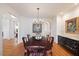 Formal dining room features wood floors and wainscoting at 3928 White Chapel Way, Raleigh, NC 27615