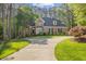 Traditional brick home boasts lush landscaping and a winding driveway at 3928 White Chapel Way, Raleigh, NC 27615
