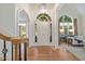 Bright foyer features wood floors and an arched doorway at 3928 White Chapel Way, Raleigh, NC 27615