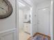 Bright entryway featuring white walls, elegant trim work, and a convenient powder room with stylish fixtures and finishes at 3928 White Chapel Way, Raleigh, NC 27615