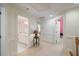 Spacious hallway showcasing access to multiple rooms, neutral decor, and ample natural light at 3928 White Chapel Way, Raleigh, NC 27615